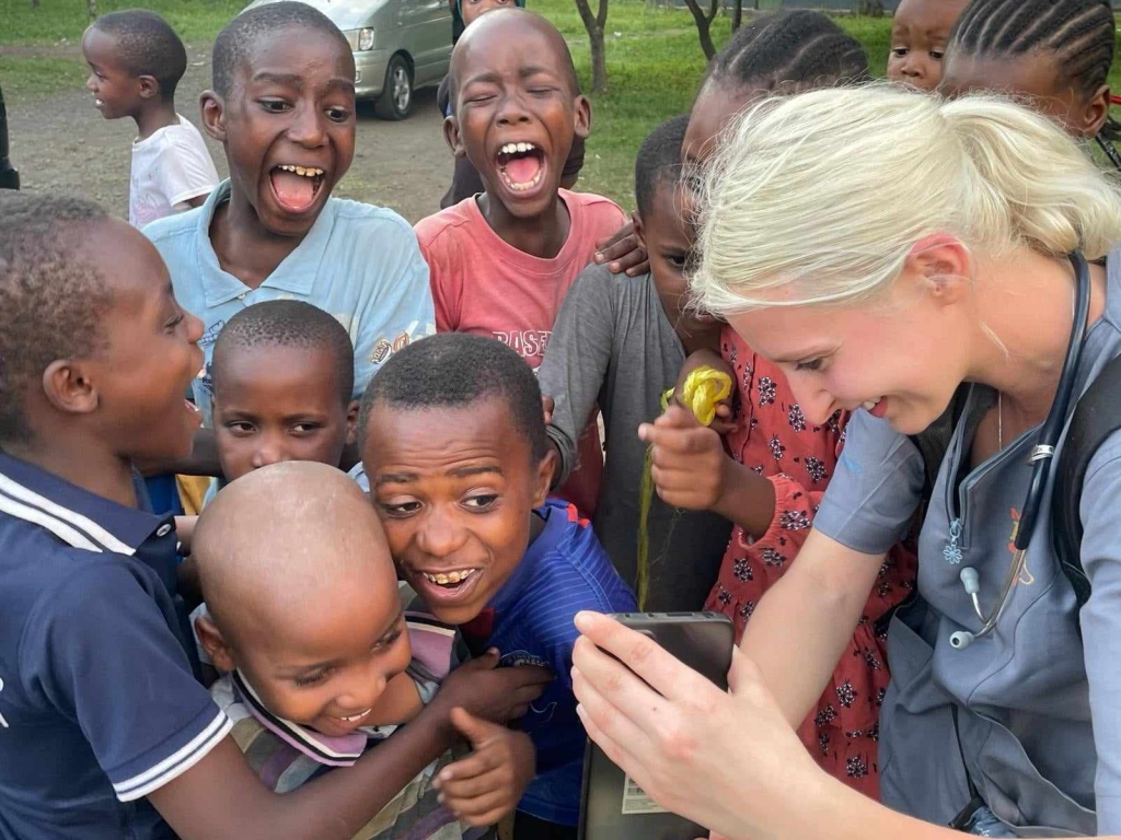 Kasia in Africa with a group of children